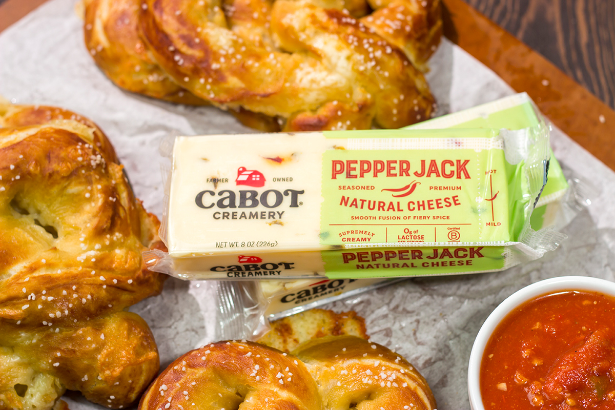 These Cheesy Soft Pretzels are stuffed with melty cheese for the ultimate gameday snack. These warm, golden brown pretzels are absolutely irresistible!