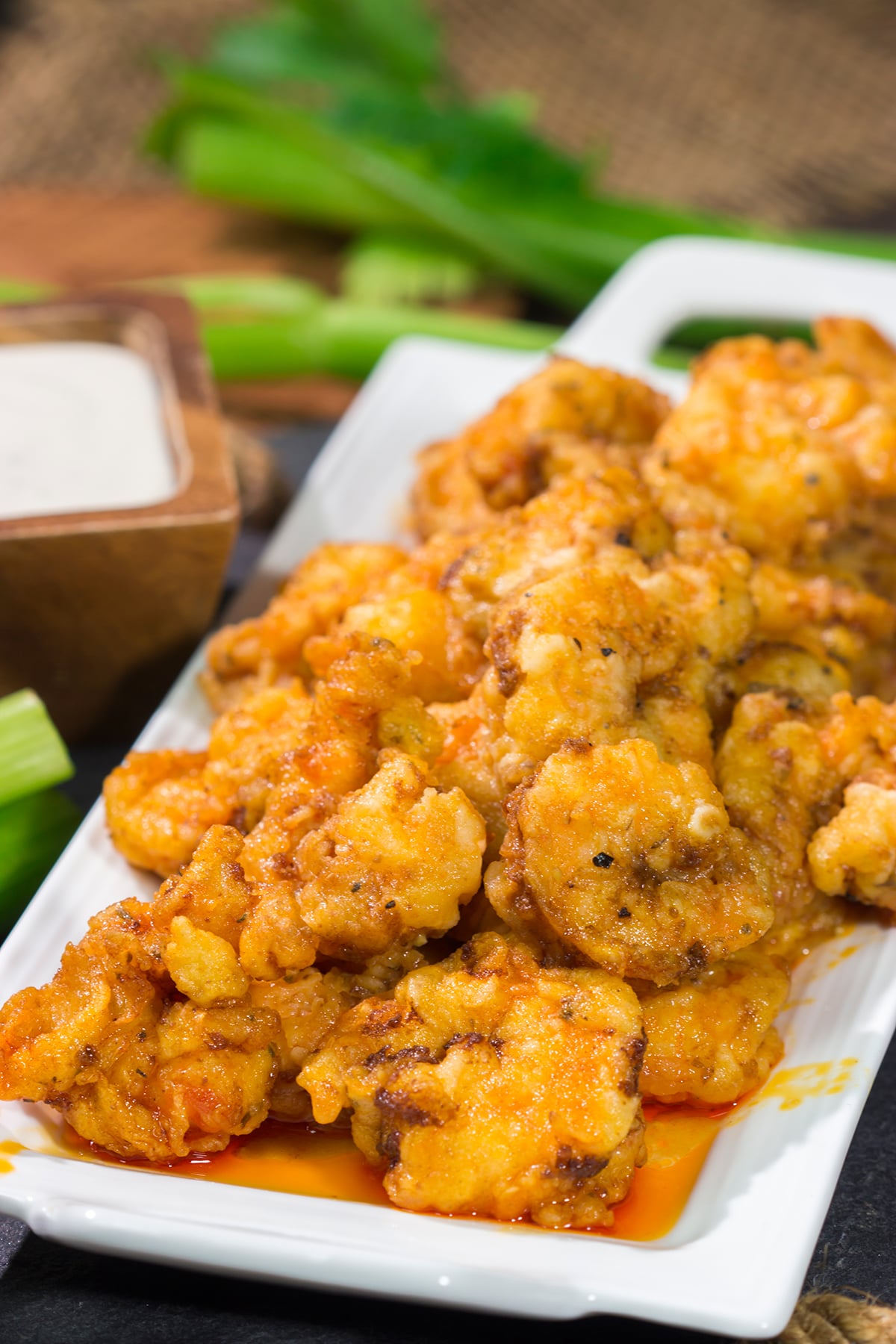 These Fried Buffalo Shrimp are the perfect gameday appetizer! The crispy fried shrimp are tossed in homemade buffalo sauce for maximum flavor.