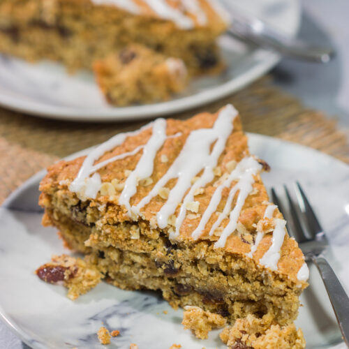 These delicious Oatmeal Raisin Bars taste just like the classic cookie...but they're easier to make. Grab a skillet and bake these bars for dessert tonight!