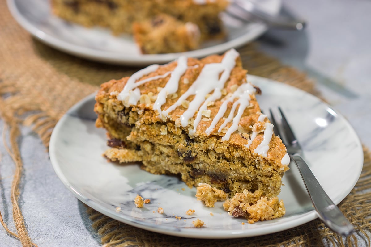 These delicious Oatmeal Raisin Bars taste just like the classic cookie...but they're easier to make. Grab a skillet and bake these bars for dessert tonight!