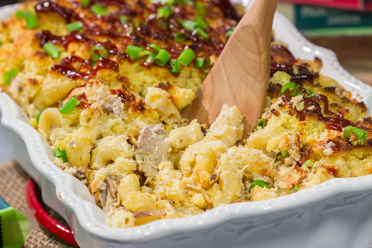 This BBQ Mac & Cheese recipe combines multiple favorites into one! Creamy mac and cheese, tender pulled pork and crumbled cornbread all combine to create a delicious dish.