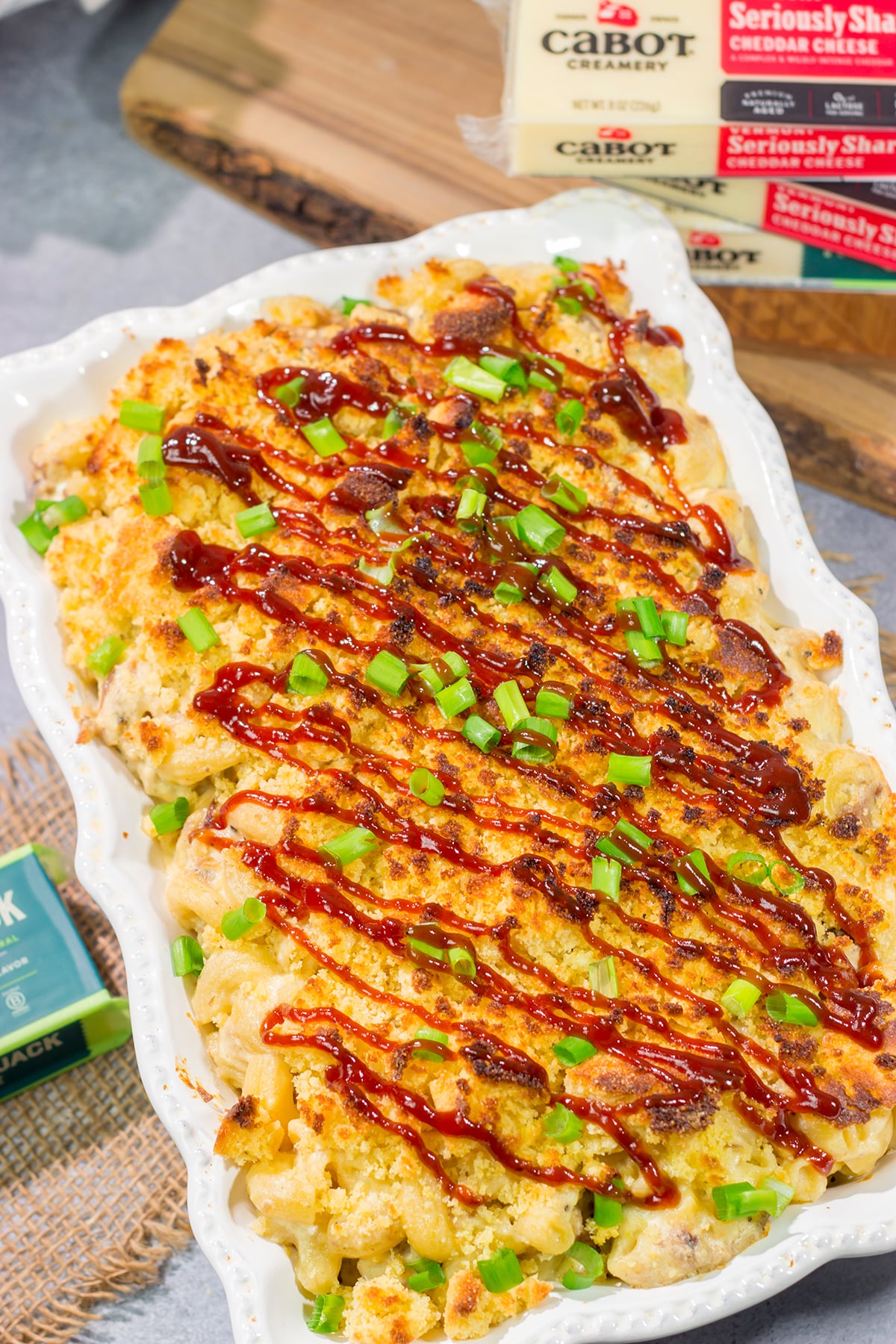 This BBQ Mac & Cheese recipe combines multiple favorites into one! Creamy mac and cheese, tender pulled pork and crumbled cornbread all combine to create a delicious dish.