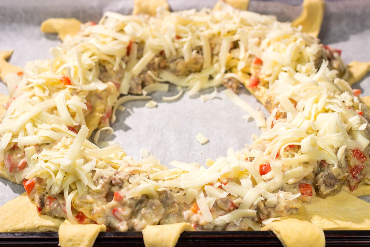 This Cheesy Sausage Wreath features creamy sausage gravy wrapped in golden brown dough. It makes for an excellent holiday breakfast or brunch when guests are in town!