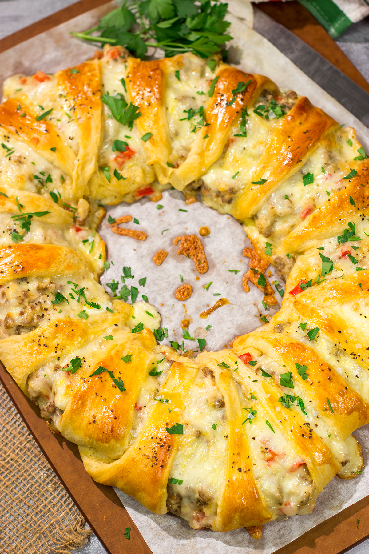 This Cheesy Sausage Wreath features creamy sausage gravy wrapped in golden brown dough. It makes for an excellent holiday breakfast or brunch when guests are in town!