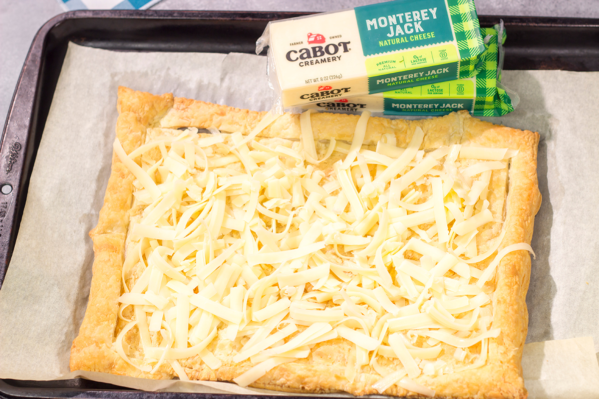 This Cheesy Mushroom Asparagus Tart features flaky puff pastry piled with savory mushrooms, tender asparagus and plenty of melted cheese. It's an easy yet elegant recipe that's perfect for an appetizer or side dish!